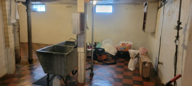 3229 Chicago Ave, Minneapolis, MN 55407 - below grade area with tile patterned floors, plenty of natural light, and a sink