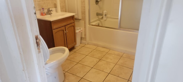 3229 Chicago Ave, Minneapolis, MN 55407 - bathroom with vanity, enclosed tub / shower combo, tile patterned flooring, and a bidet