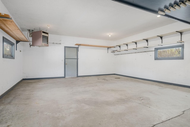 4416 Louisiana Ave N, Crystal, MN 55428 - garage featuring baseboards