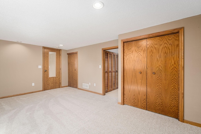 4416 Louisiana Ave N, Crystal, MN 55428 - unfurnished bedroom featuring multiple closets, carpet flooring, baseboards, and recessed lighting