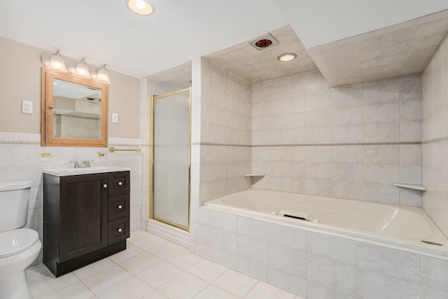 4416 Louisiana Ave N, Crystal, MN 55428 - full bath featuring tile walls, tile patterned flooring, toilet, a stall shower, and vanity