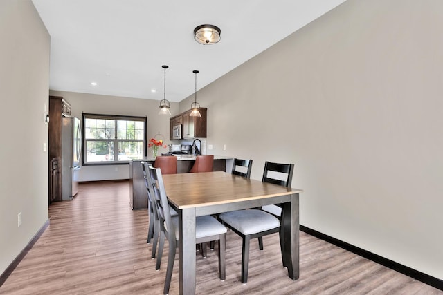 10240 3rd St NE Unit D, Blaine, MN 55434 - dining space with light wood finished floors, baseboards, and recessed lighting