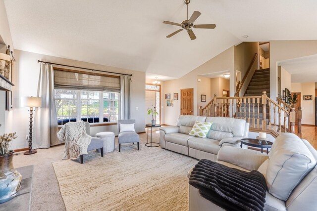 1103 Park Ln SE, New Prague, MN 56071 - living area with stairs, ceiling fan, vaulted ceiling, and baseboards