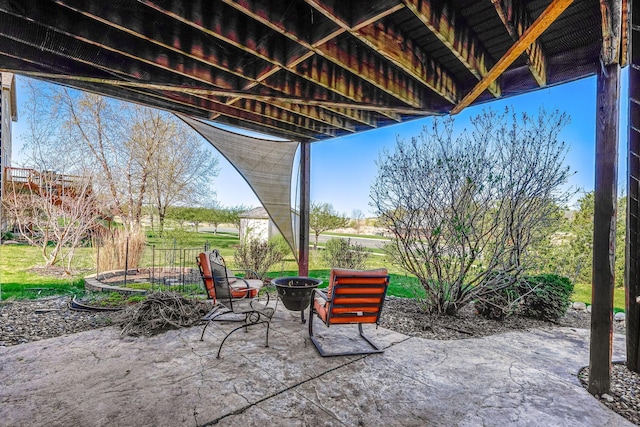 1103 Park Ln SE, New Prague, MN 56071 - view of patio featuring an outdoor fire pit