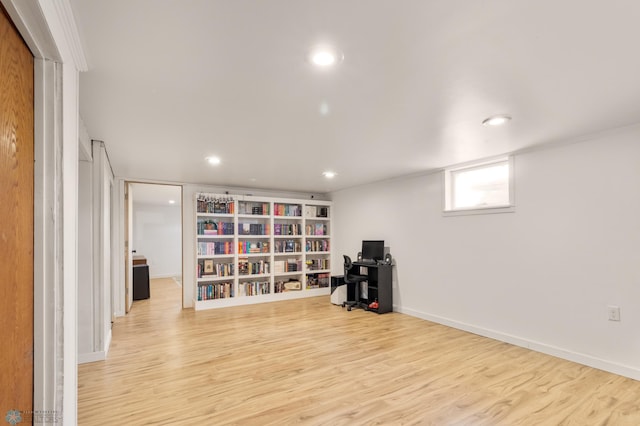 unfurnished room with wood finished floors, recessed lighting, and baseboards