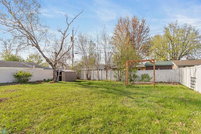 view of yard featuring a storage shed and an outdoor structure