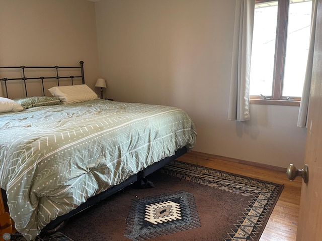 101 Oak St, Lisbon, ND 58054 - bedroom with wood finished floors and baseboards