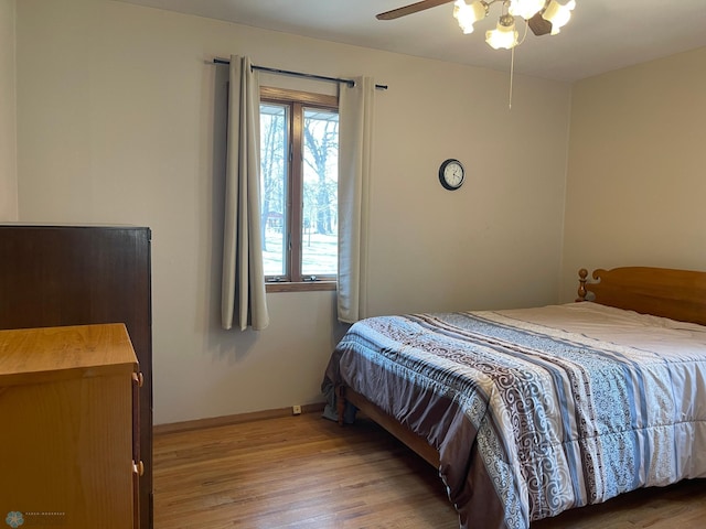 101 Oak St, Lisbon, ND 58054 - bedroom featuring wood finished floors, baseboards, and a ceiling fan