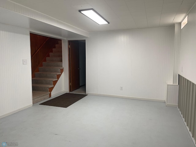 101 Oak St, Lisbon, ND 58054 - finished below grade area featuring stairs and wooden walls