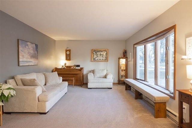 living area featuring baseboards, light carpet, and baseboard heating