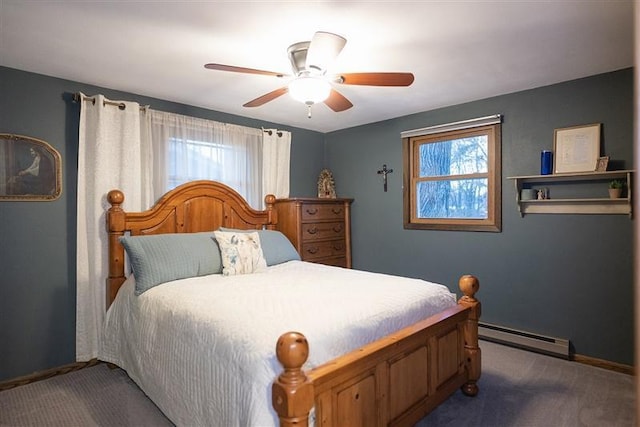 bedroom with baseboards, baseboard heating, a ceiling fan, and carpet floors