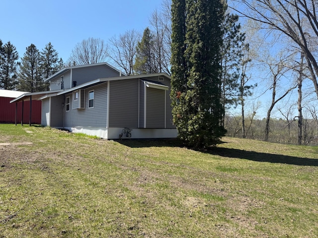 view of home's exterior featuring a yard