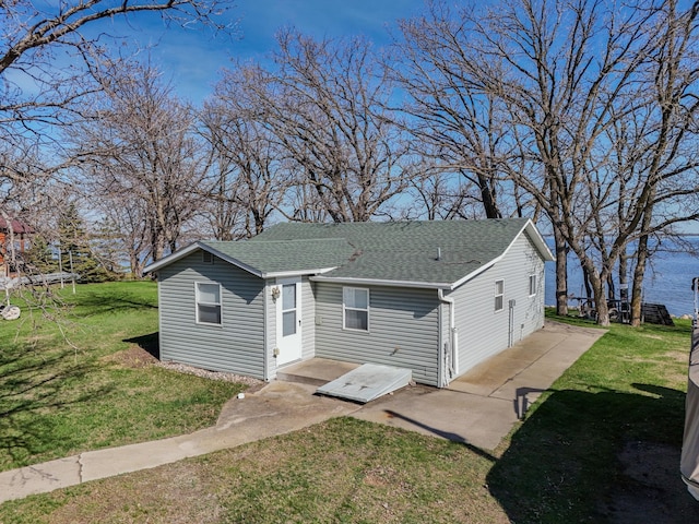 44948 Plentywood Rd, Perham, MN 56573 - back of property featuring a shingled roof and a yard