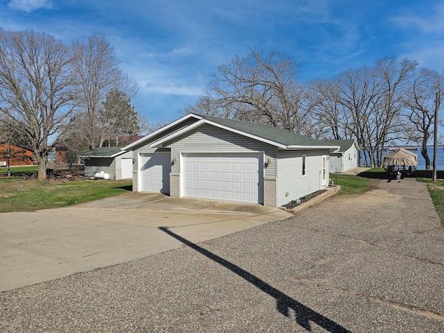 44948 Plentywood Rd, Perham, MN 56573 - view of side of home featuring brick siding and driveway