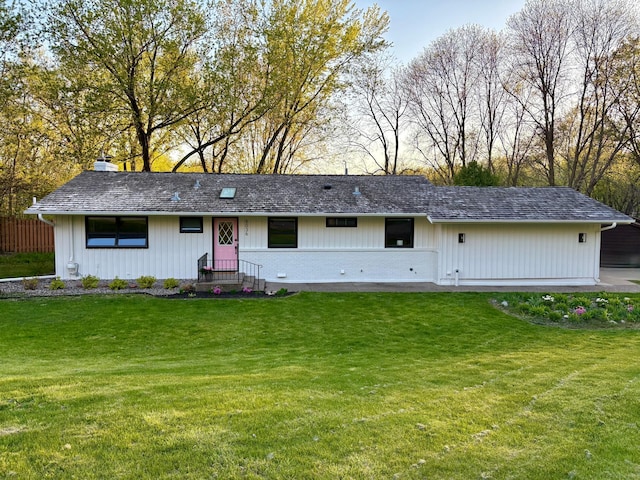 view of front of property featuring a front lawn and a chimney
