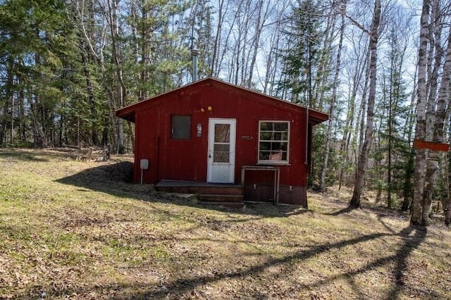 26159 County Road 345, Bigfork, MN 56628 - view of outdoor structure featuring entry steps, an outdoor structure, and a forest view