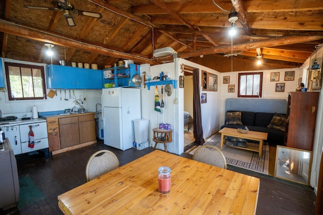 26159 County Road 345, Bigfork, MN 56628 - kitchen featuring freestanding refrigerator, lofted ceiling, ceiling fan, and dark wood-style floors