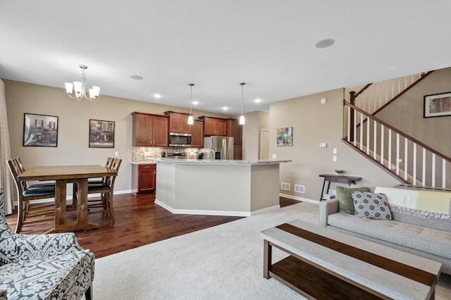 living room featuring a chandelier, stairway, dark carpet, recessed lighting, and baseboards