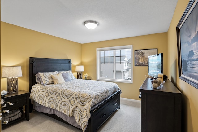 bedroom featuring light carpet and baseboards