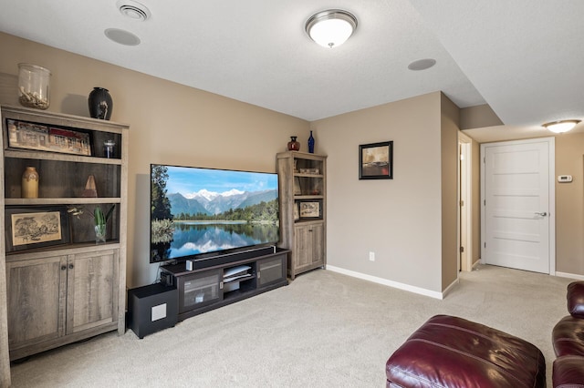 living area featuring carpet flooring and baseboards