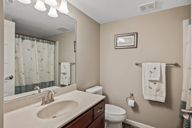 full bathroom with toilet, a textured ceiling, vanity, baseboards, and curtained shower