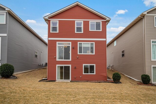 back of property with a yard