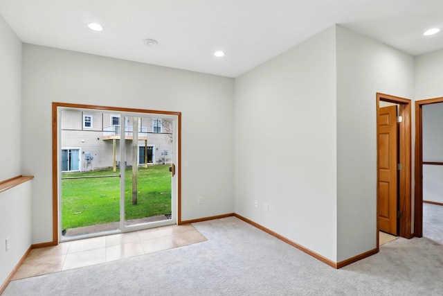 unfurnished room with baseboards, recessed lighting, and carpet