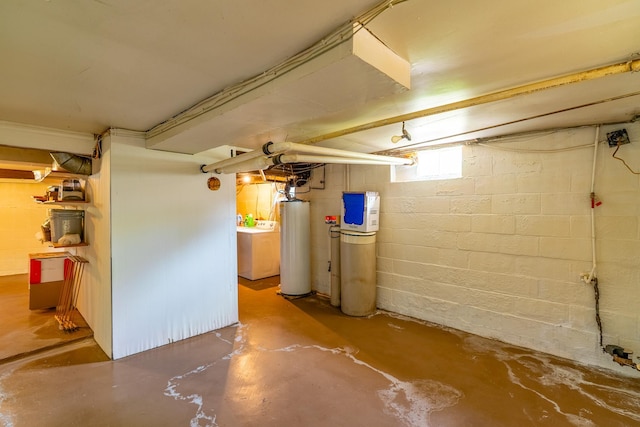 basement with gas water heater and washer / clothes dryer