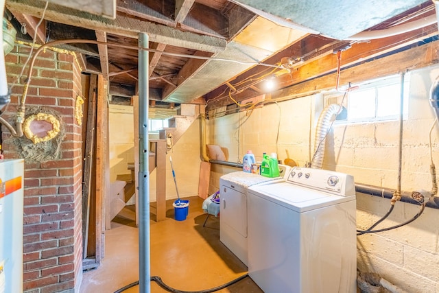 washroom with independent washer and dryer and gas water heater