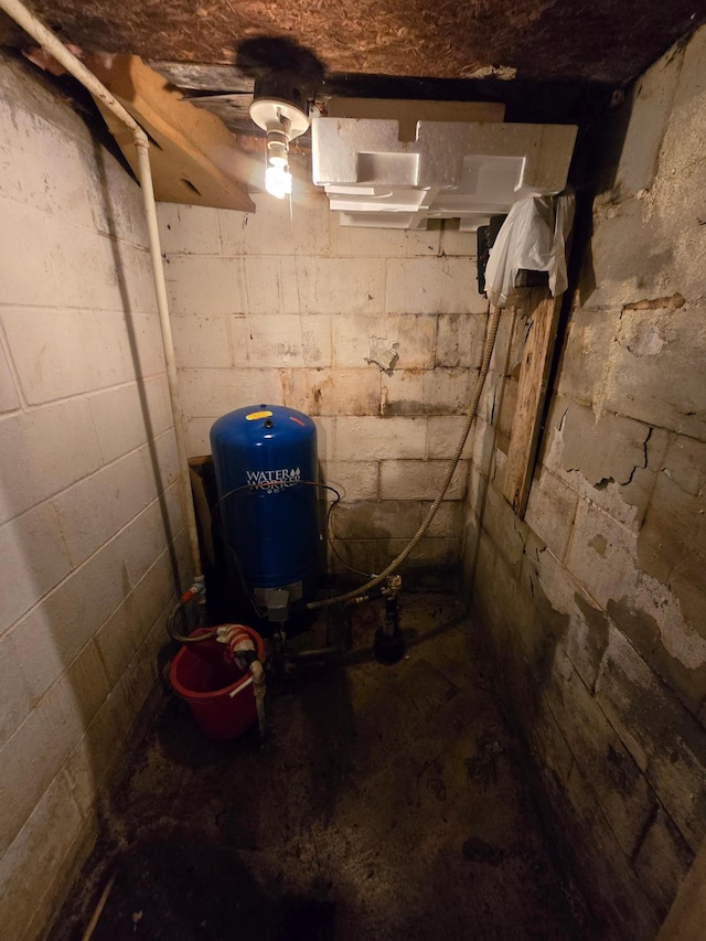 unfinished basement with a water pressure tank