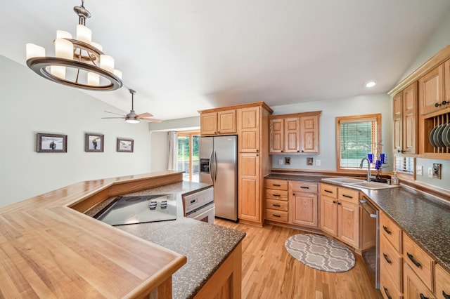 1036 Creekview Ln, Belle Plaine, MN 56011 - kitchen featuring appliances with stainless steel finishes, a sink, light wood finished floors, a ceiling fan, and dark countertops