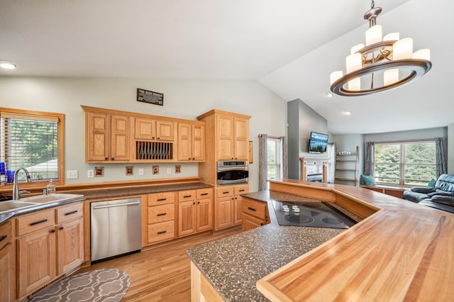 1036 Creekview Ln, Belle Plaine, MN 56011 - kitchen with stainless steel appliances, vaulted ceiling, a sink, light wood-style floors, and open floor plan