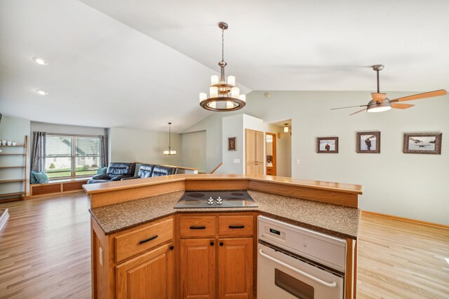 1036 Creekview Ln, Belle Plaine, MN 56011 - kitchen featuring black electric cooktop, oven, light wood finished floors, open floor plan, and vaulted ceiling