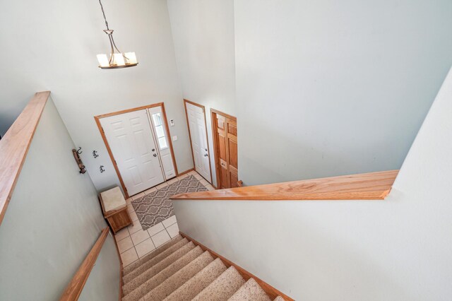 1036 Creekview Ln, Belle Plaine, MN 56011 - foyer entrance featuring tile patterned flooring, stairs, and a high ceiling