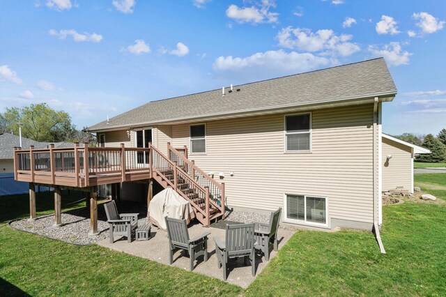 1036 Creekview Ln, Belle Plaine, MN 56011 - rear view of house featuring a wooden deck, a patio, a yard, stairway, and roof with shingles