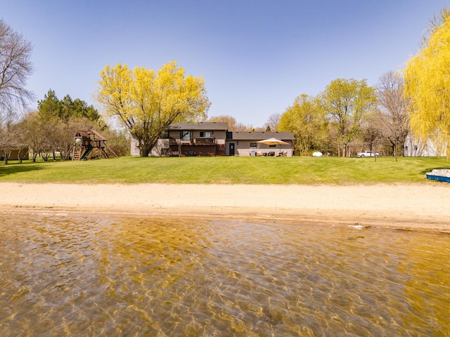 5123 Green Meadow Rd SE, Osakis, MN 56360 - view of front of home featuring playground community and a front lawn