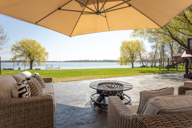 5123 Green Meadow Rd SE, Osakis, MN 56360 - view of patio with an outdoor fire pit and a water view