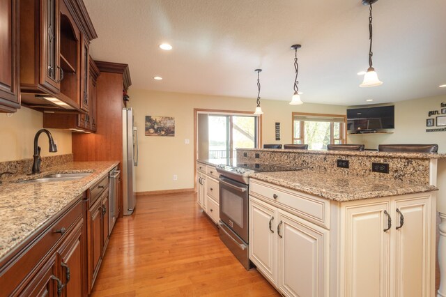 5123 Green Meadow Rd SE, Osakis, MN 56360 - kitchen featuring light wood finished floors, stainless steel appliances, a sink, and light stone countertops