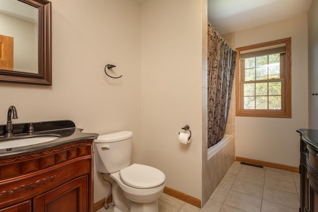 5123 Green Meadow Rd SE, Osakis, MN 56360 - full bathroom featuring toilet, vanity, visible vents, tile patterned floors, and baseboards