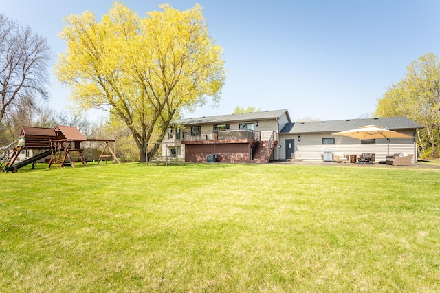5123 Green Meadow Rd SE, Osakis, MN 56360 - view of yard featuring a patio, an outdoor hangout area, stairway, a wooden deck, and a playground