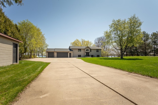 5123 Green Meadow Rd SE, Osakis, MN 56360 - view of front of home featuring driveway, a garage, and a front yard