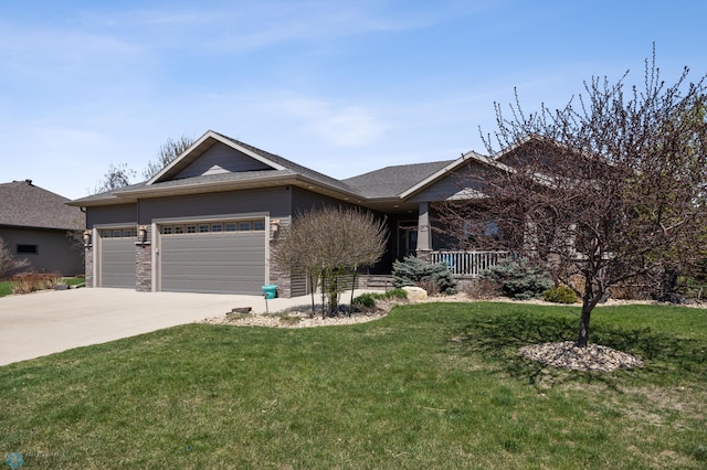 view of front of property with a garage, a front lawn, a porch, and concrete driveway