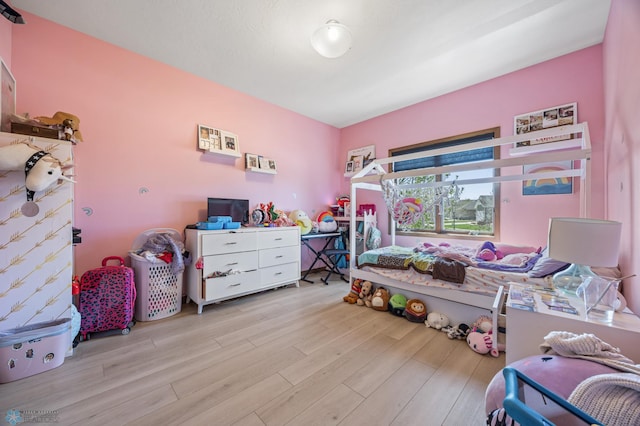 bedroom featuring wood finished floors