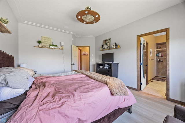 bedroom featuring light wood-style flooring