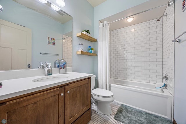 bathroom featuring tile patterned floors, shower / bath combo, toilet, and vanity