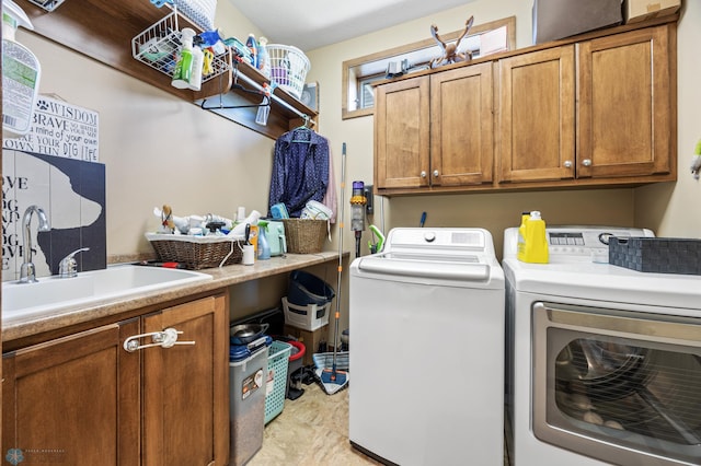 laundry area featuring washer and dryer and cabinet space
