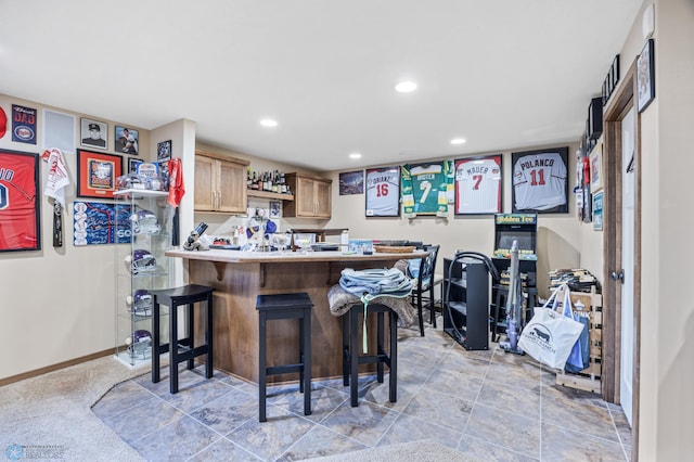 indoor dry bar featuring recessed lighting and baseboards