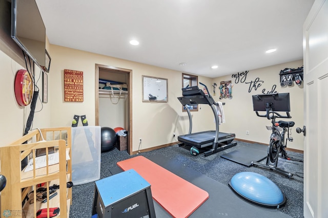 exercise room featuring baseboards and recessed lighting