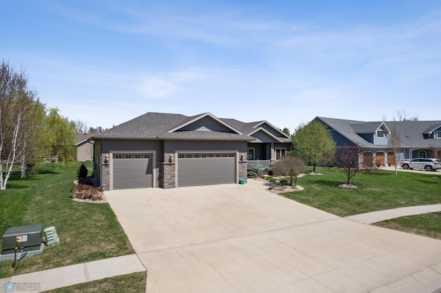 view of front of house with a garage, a front yard, and driveway