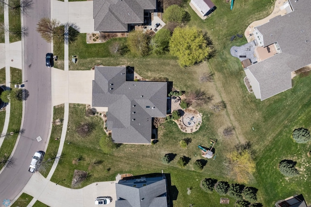 aerial view of property and surrounding area featuring nearby suburban area